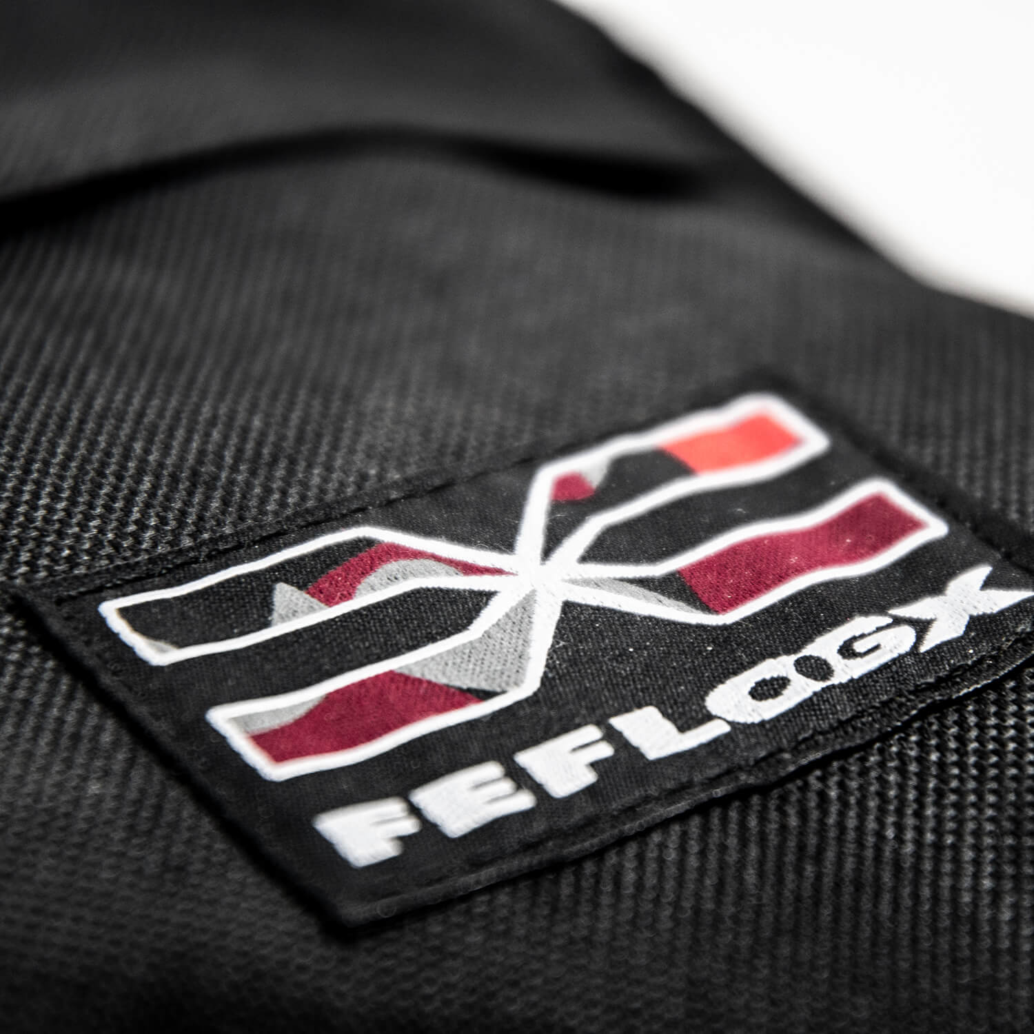 FEFLOGX Sportswear Umhängetasche Prime, Logo-Stick Detail.